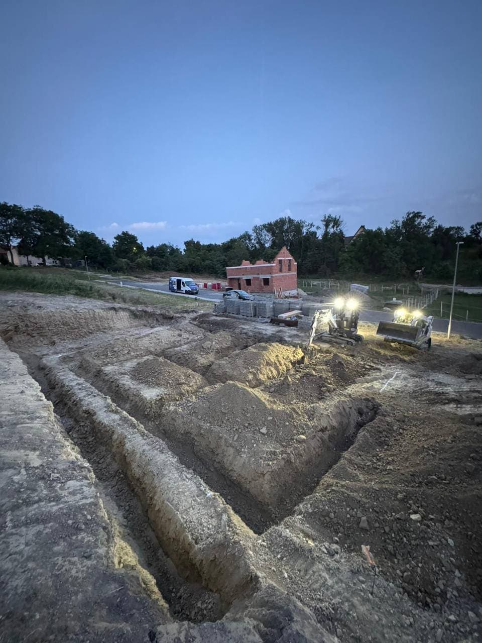 Foundation trenches for a family house at dusk — a turnkey build by RayBer