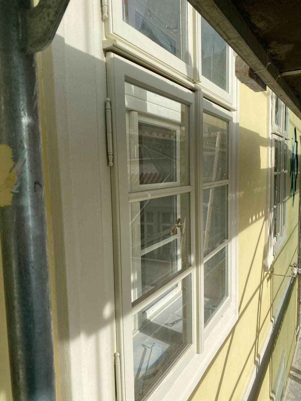 Box window in a restored facade with painted decoration